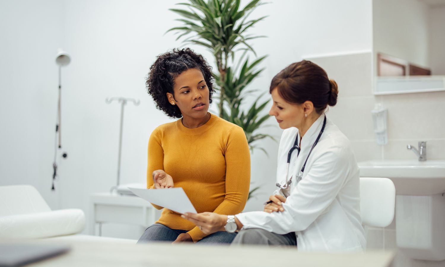 Doctor discussing medical results with a patient in an office setting.